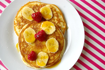 Breakfast crumpets with banana and rasperry