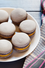 Gray macaroons on plate