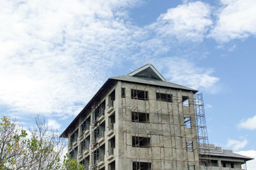 building house under blue sky.
