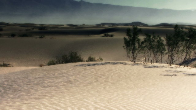 Dunes 011: A dust storm over gentle desert dunes.