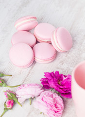 Fototapeta na wymiar Pastel pink macaroons with rose