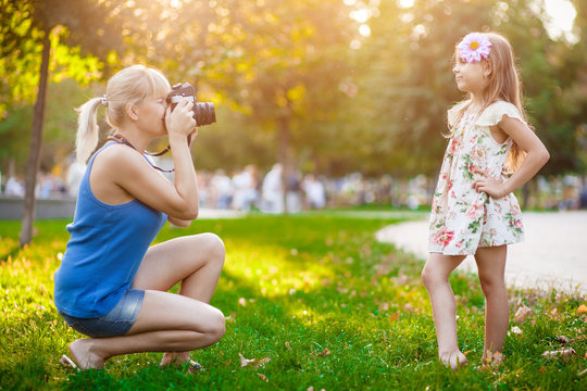 Woman photographing child