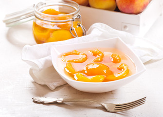 canned peaches in a bowl