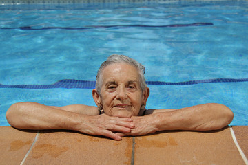 Senior Woman Having Fun In Swimming Pool