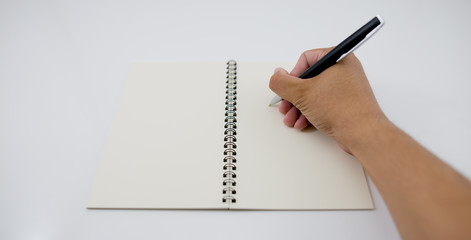  write something down on a notebook.