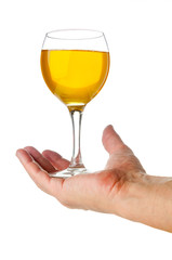 Hand holds wineglass on white background