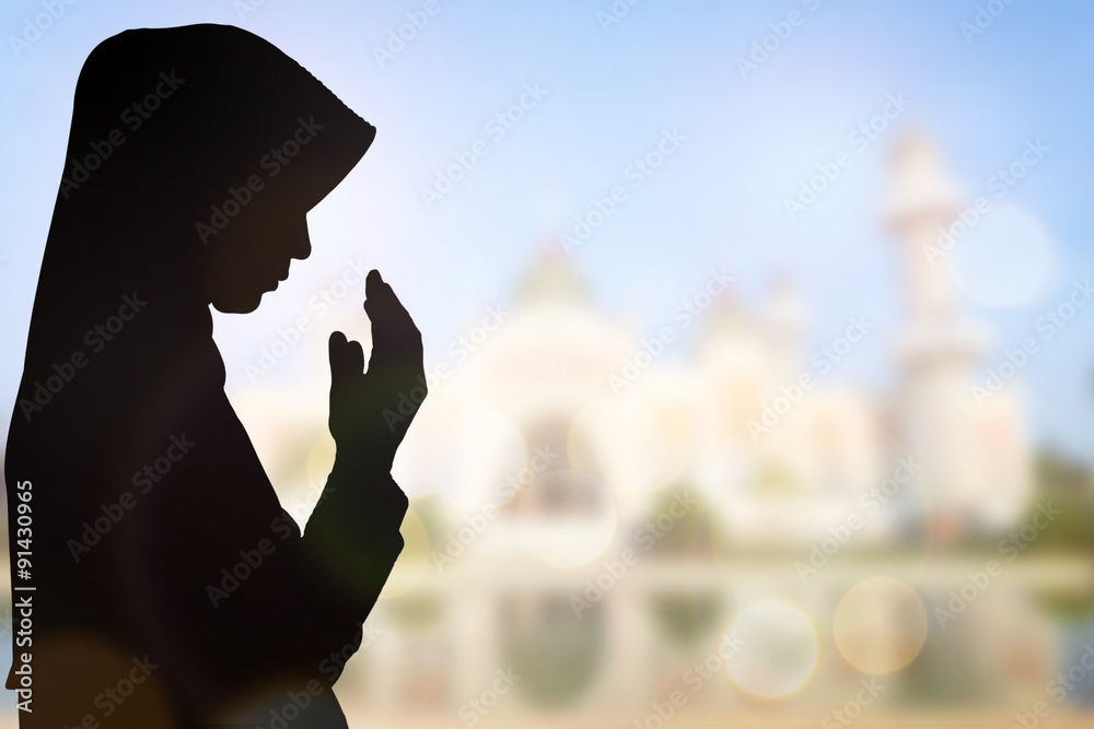 Wall mural Muslim Woman pray and Beautiful background..