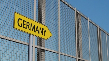 Obraz premium Germany Signpost on metall fence / border fence