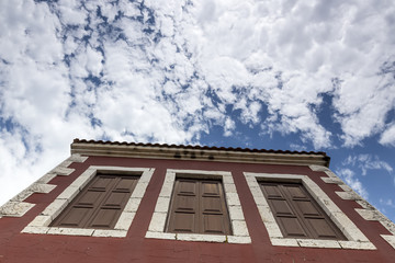 Fragment of beautiful residential house on blue sky background.