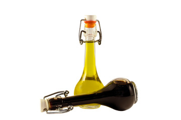 Two bottles of wine vinegar and olive oil