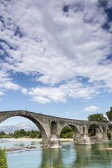Fototapeta premium The Bridge of Arta is an old stone bridge that crosses the Arach