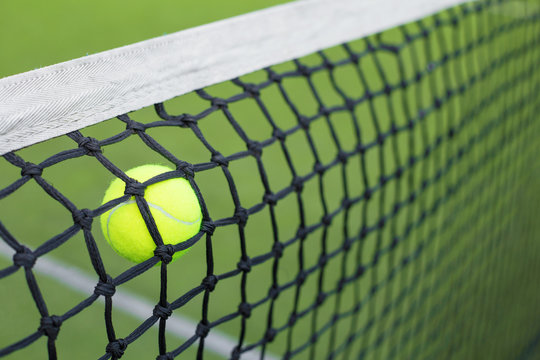 Tennis ball in the net