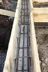 Obraz premium building foundations, reinforcement, concrete rubble, wooden for