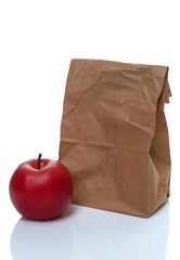 Brown paper lunch bag with red apple