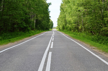 Fototapeta na wymiar Asphalt road with a white marking