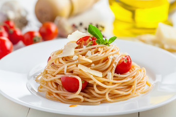 Pasta in tomato sauce with parmesan cheese and basil