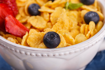 Corn flakes and fresh berries, for Breakfast. selective focus