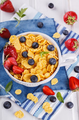 Corn flakes and fresh berries, for Breakfast. selective focus