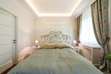 Double bed in the apartment interior