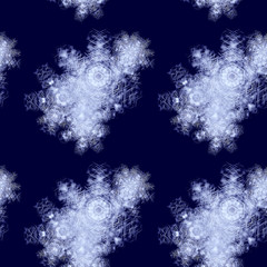 Obraz premium Abstract dark blue winter background with snowflakes and ice flowers