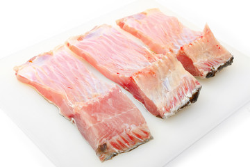 Carp fillets on white background. In Central Europe ( Poland and Czech Republic ), fish is a traditional part of a Christmas Eve dinner. 
