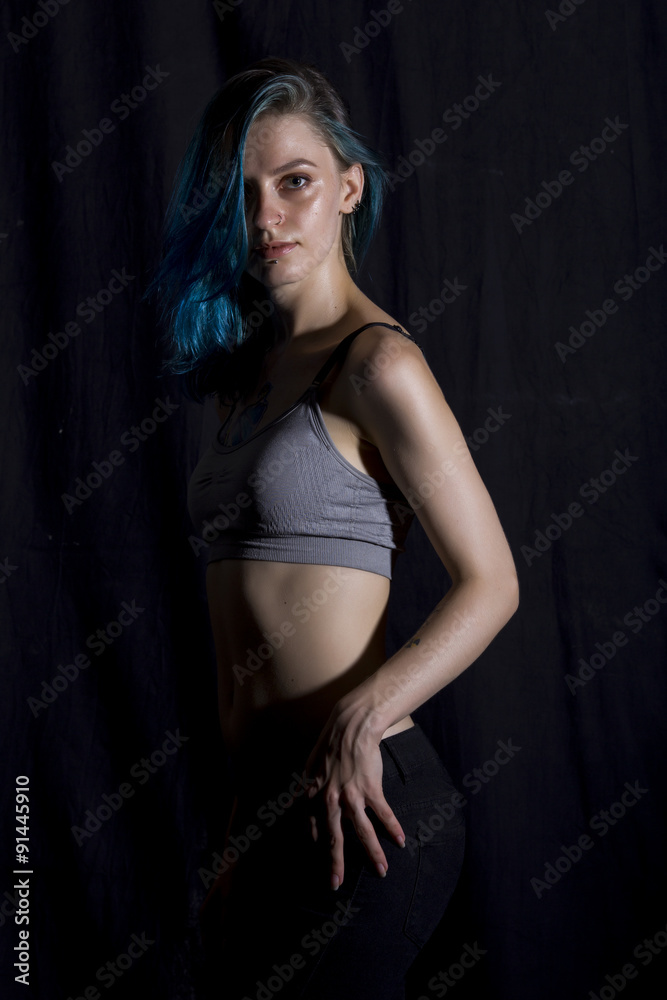 Wall mural Blue haired girl pose in studio