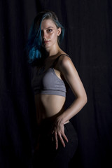 Blue haired girl pose in studio