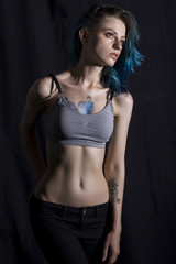 Fototapeta na wymiar Blue haired girl pose in studio