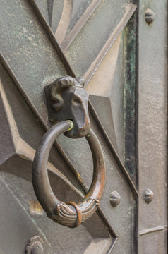 ram's head knocker on brass door