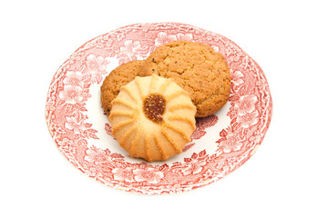 various of cookies on a dish on white