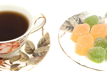 cup of tea and fruit candy