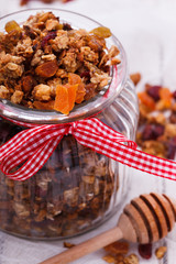 Granola from several types of cereals with nuts,honey,raisins