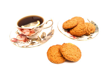 mug of tea with lemon and oatmeal cookies