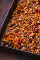 Granola from several types of cereals with nuts,honey,raisins
