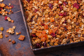 Granola from several types of cereals with nuts,honey,raisins