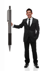 Business man holding a giant pen