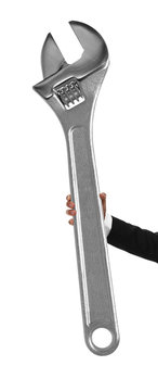 Hand holding a giant adjustable wrench