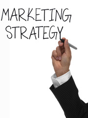 Hand writing the words marketing strategy