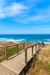 Fototapeta na wymiar Wooden walkway to Praia do Amado beach, Algarve region, Portugal
