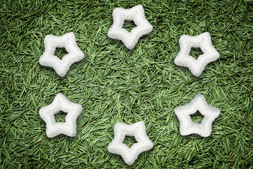 Christmas holidays background with white stars like snowflakes