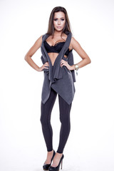 Fototapeta premium Young slim sexy woman in black dress isolated on white backgroun