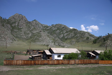 Fototapeta na wymiar SIBERIA, RUSSIA - JUNE 10, 2012: Village at the Altai mountains, Russia