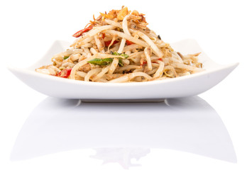Malaysian dish bean sprout salad or local name Kerabu Taugeh in a white plate over white background
