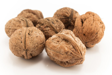 Walnuts in shell isolated on white