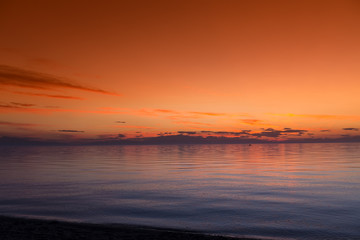 Beautiful sunset with clouds in the sky over ocean