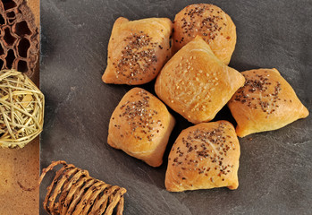 Hot and crispy homemade puff  pocket pies with meat and sprinkled with sesame and chia seeds.