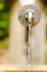 water drops from a tap