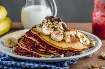 Homemade pancakes with currant jam
