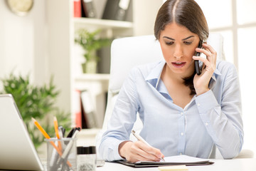 Fototapeta premium Businesswoman Phoning In The Office