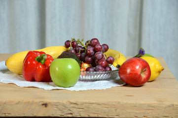 Fototapeta na wymiar Fruits and Vegetables on Wooden Tab;e